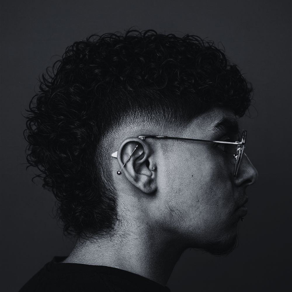 modern mullet on curly texture toronto MANO Barbers lounge